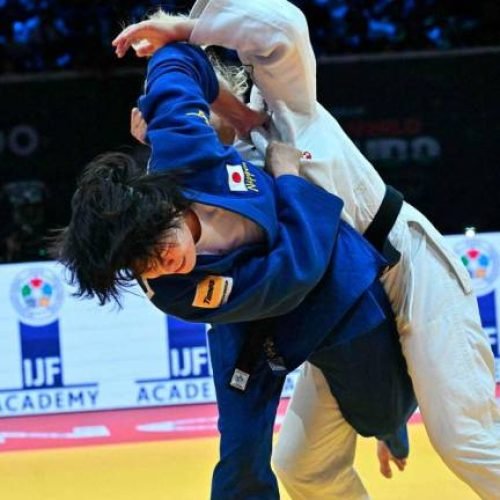 Japan's Shiho Tanaka (blue) competes against Croatia's Lara Cvjetko during the women's -70kg fianl bout of the Judo World Championships at the Papp Laszlo Arena in Budapest, Hungary, on June 17, 2025. - AFPPIX