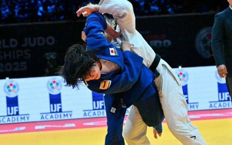 Japan's Shiho Tanaka (blue) competes against Croatia's Lara Cvjetko during the women's -70kg fianl bout of the Judo World Championships at the Papp Laszlo Arena in Budapest, Hungary, on June 17, 2025. - AFPPIX
